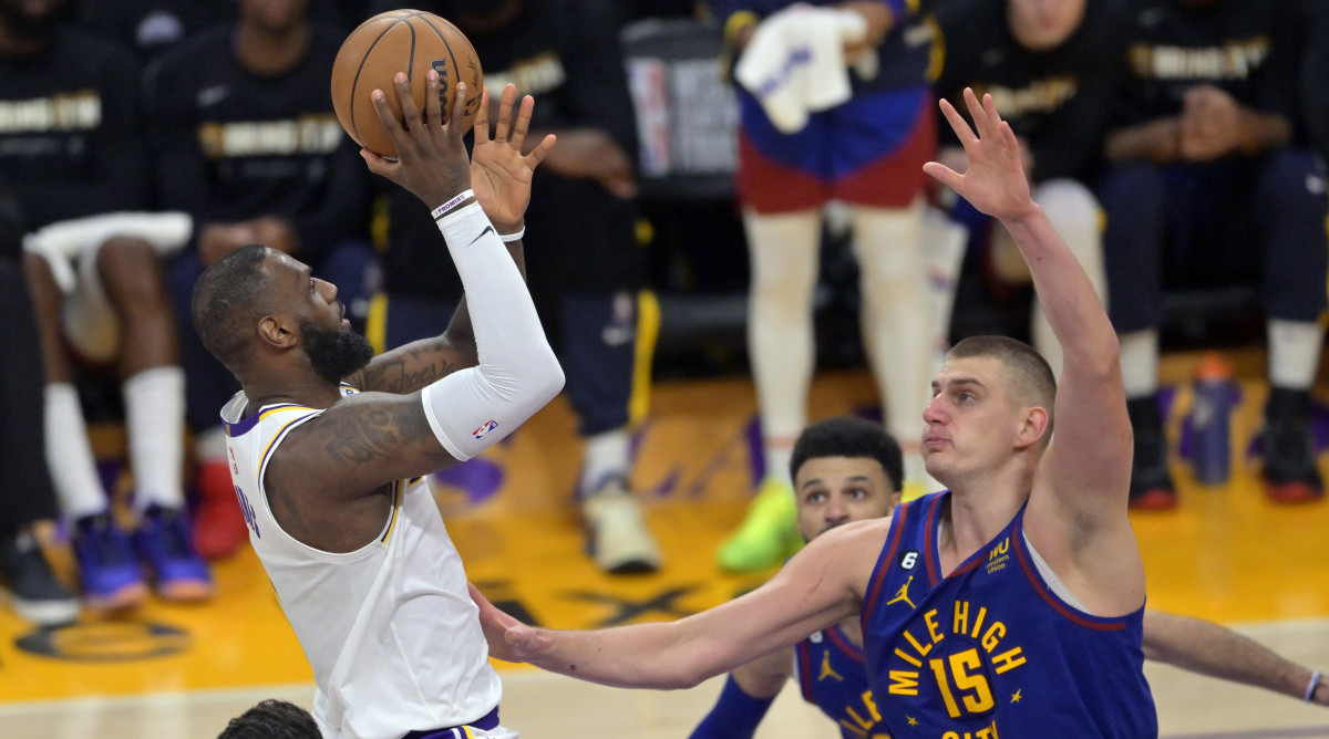 LeBron James shoots against the Nuggets